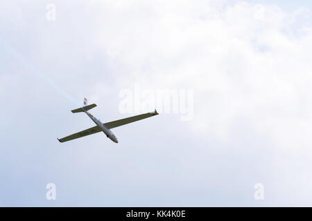 PLASY, CZECH REPUBLIC - APRIL 30: Aerobatic two-seat all-metal Let L-13AC Blanik glider for dual aerobatic training fly on April 30, 2017 in Plasy, Cz Stock Photo