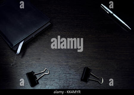 Stationery items lying on the desktop. Place to work at home. Of Stock Photo
