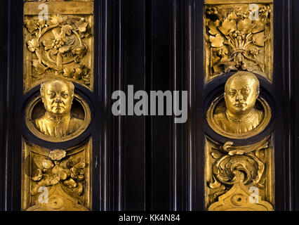 Lorenzo Ghiberti on the Paradise Gate ot the Baptisterio (Florence) self portrait The Florence Baptistery ( Battistero di San Giovanni), Baptistery of Saint John,  East doors, or Gates of Paradise, by Lorenzo Ghiberti  ( The Cattedrale di Santa Maria del Fiore of Florence - Cathedral of Saint Mary of the Flower 1336 )  Museo dell'Opera del Duomo Florence Italy Italian. (original door panel ) Stock Photo