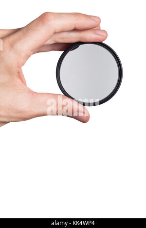 Hand holding a circular polarizing filter Stock Photo