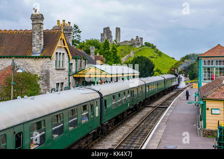 CORFE, UNITED KINGDOM - SEPTEMBER 06: This is a view of Corfe Castle railway station with an old steam train passing through on September 06, in Corfe Stock Photo