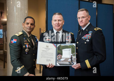 Brig. Gen. Pedro Pablo Hurtado, deputy commander, Dominican Republic Army; Maj. Gen. Mark Stammer, commanding general, U.S. Army South; and Maj. Gen. Michael Howard, commanding general, Military District of Washington; pose for a photo in the Memorial Amphitheater Display Room at Arlington National Cemetery, Arlington, Virginia, Nov. 9, 2017.  Earlier, Hurtado and Stammer participated in an Army Full Honors Wreath-Laying Ceremony on behalf of the Conference of the American Armies at the Tomb of the Unknown Soldier. (U.S. Army photo by Elizabeth Fraser / Arlington National Cemetery / released) Stock Photo