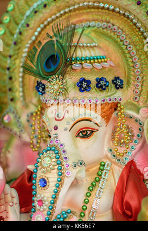 Close up face of Hindu God Ganesha in selective focus. Stock Photo
