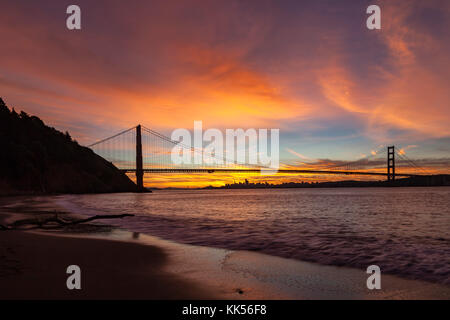Golden Gate Bridge and San Francisco at dawn viewed from Kirby Cove. Stock Photo