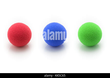 Red, Blue, Gree Small Sponge Balls on White Background, concept of RGB Colors Stock Photo