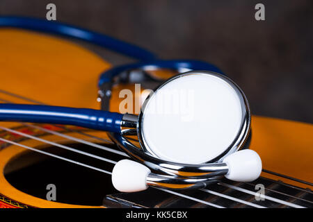 Stethoscope on classical guitar , music therapy Stock Photo