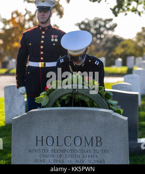 Captain Kaitlin E. Kleiber, officer with Marine Barracks Washington D.C., lays a wreath at the gravestone of Gen. Thomas Holcomb, 17th Commandant of the Marine Corps, during a wreath laying ceremony at Arlington National Cemetery, Arlington, Va., Nov. 10, 2017. The wreath laying ceremony is an annual event held to celebrate the U.S. Marine Corps’ birthday and honor those who gave the last full measure of devotion to country and Corps. (Official U.S. Marine Corps photo by Cpl. Robert Knapp/Released) Stock Photo