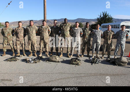 The Best of the Best competitors in the California Army National Guard's 2017-18 Best Warrior Competition unite before the popular, but always challenging, Obstacle Course event Nov. 7 at Camp San Luis Obispo, California. Shown: Staff Sgt. Salvador Gutierrezzepeda; Sgt. George Ruiz; Staff Sgt. Francisco Vianaescobar, Spc. David Enriquez-Ortiz, Spc. Devon Witt, Spc. Deng A. Deng, Staff Sgt. Jared Jonassan, Pfc. Michael Usher, Spc. Michelle Freckleton, Sgt. Joshua Monday and Spc. Fabio Avetisyan. The event will determine California’s Soldier and Noncommissioned Officer of the Year, and winners w Stock Photo