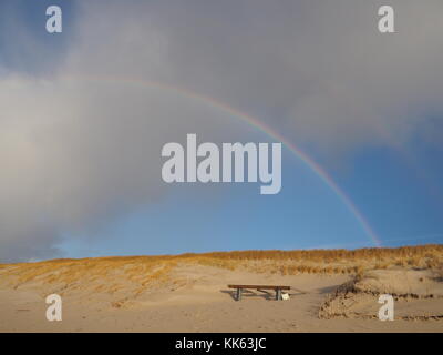 Rainbow over the sand dunes in hörnum, island of sylt Stock Photo
