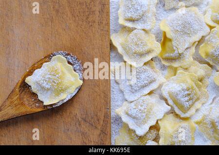 Close-up of pile of vareniki covered with flour.From above Stock Photo