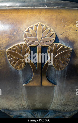 Nagano - Japan, June 5, 2017: Decoration of lotus flowers on a bronze incense burner in front of the Buddhist Zenkoji temple Stock Photo