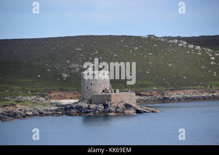 Oliver Cromwell's Castle on Tresco from the Island of Bryher in the Isles of Scilly, Cornwall, United Kingdom, UK. Stock Photo