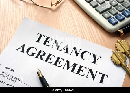 Tenancy agreement and keys from home in a real estate agency. Stock Photo