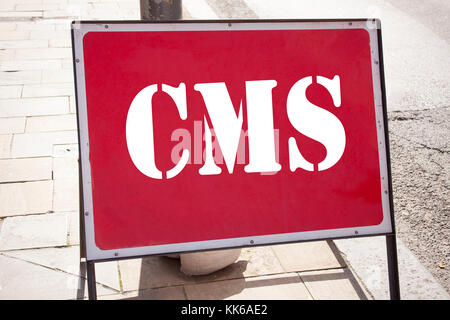 Conceptual hand writing text caption inspiration showing CMS. Business concept for CMS WWW written on announcement road sign with background and space Stock Photo