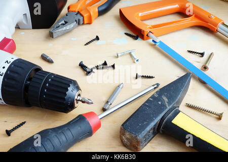 Different tools for house renovation or DIY on a wooden background. Stock Photo
