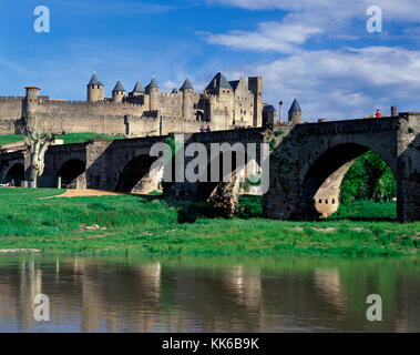 The fortified city of La Cite Carcassonne and the Pont Vieux crossing the Aude river, Aude, France Stock Photo