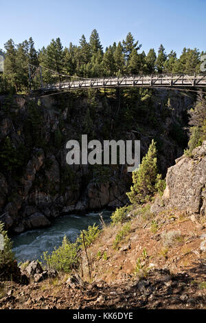 WY02670-00...WYOMING - Bridge over the Yellowstone River on the Hellroaring Creek Trail in Yellowstone National Park. Stock Photo