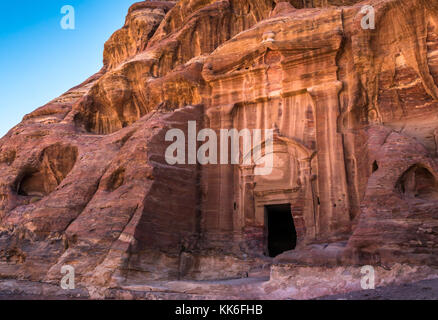 Nabataean tomb carved from red sandstone cliff in Wadi Farasa, Petra, Jordan, Middle East, on walking route from High Place of Sacrifice Stock Photo