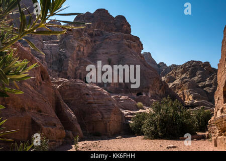 Walking route from High Place of Sacrifice through Wadi Farasa with Nabataean tombs carved into hillsides, Petra, Jordan, Middle East Stock Photo