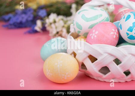 Decorated Easter eggs on a pink surface Stock Photo