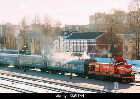 Vitebsk, Belarus. Old Diesel locomotive on Railway In Sunny Snowy Winter Day. Stock Photo