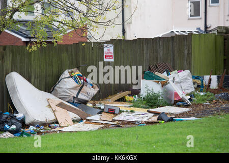 Dumped rubbish under a no dumping sign near Dartmouth Circus, Birmingham. Stock Photo