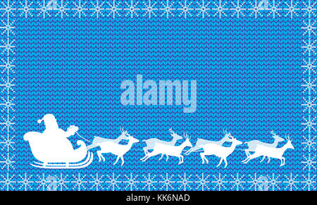 White silhouette of Santa Claus riding in a sleigh with eight reindeer on blue fabric knitted background framed with snowflakes.Christmas and New Year Stock Photo