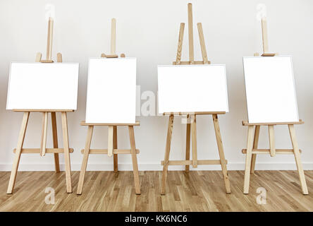 Four art studio easels with blank white frames to add paintings or pictures Stock Photo