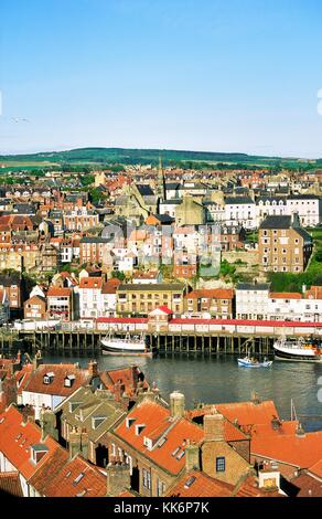 Old harbour fishing port town of Whitby on North Sea coast of Yorkshire England UK United Kingdom Stock Photo