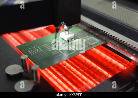 Assembling micro electronic board Stock Photo