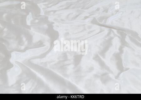 White shiny and soft polyester satin sheet background. Stock Photo