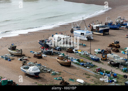 Moored fishing boats on the Slade shingle beach in Hastings Old Town, East Sussex, Britain.   The Slade is home to Europe’s largest fleet of beach – l Stock Photo