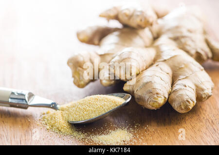 Dried and fresh ginger root on wooden table. Stock Photo