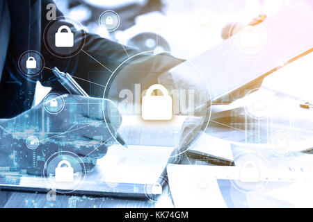 double exposure businessman writes business plan and security with global networking concept Stock Photo