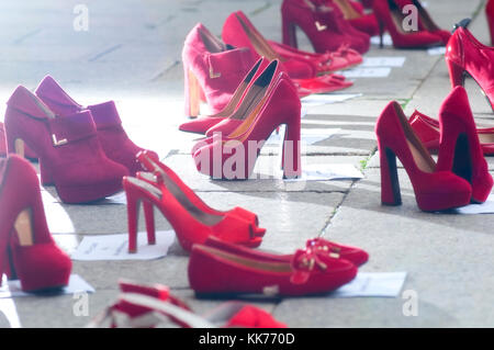 Italy, Lombardy, Exposed Red Shoes Along the Street Symbolized Rebellion Against Violence to Women Stock Photo