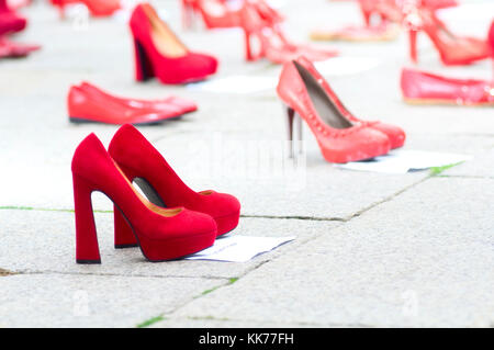 Italy, Lombardy, Exposed Red Shoes Along the Street Symbolized Rebellion Against Violence to Women Stock Photo