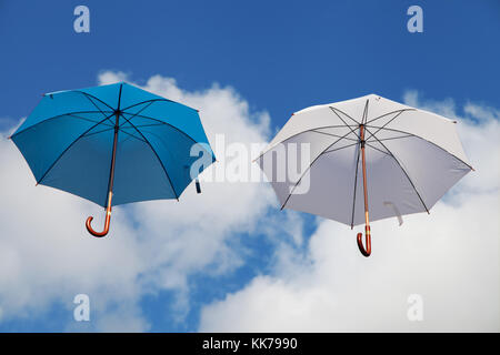 Two Floating Umbrellas in Blue and White Stock Photo