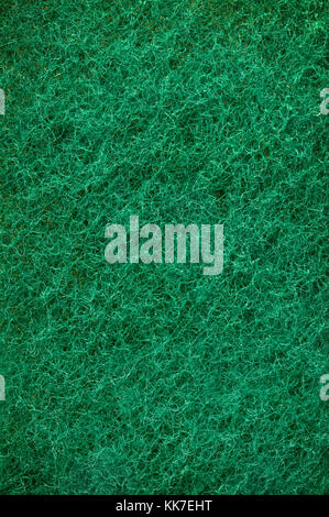 Green abrasive sponge texture background like grass Stock Photo