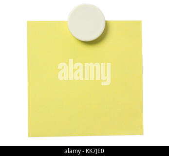 Yellow adhesive note and white magnet button on whiteboard. Stock Photo