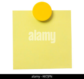 Yellow adhesive note and magnet button on whiteboard. Stock Photo