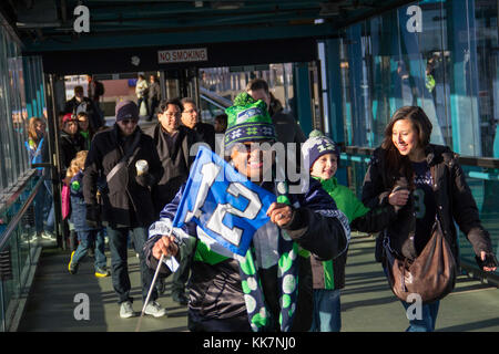 Seattle Seahawks fans waves 12th Man flags before their game against the  St. Louis Rams at CenturyLink Field in Seattle, Washington on December 30,  2012. The Seahawks came from behind to beat