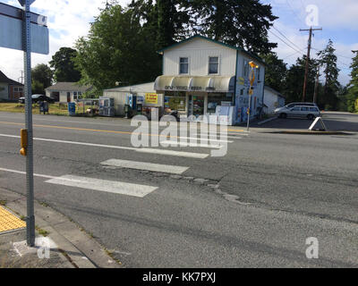 In 2018 WSDOT contractor crews will repave the highway and improve pedestrian crossings at some intersections, like this one, along the SR 20 Spur. SR 20 Spur12th Street repaving and ADA work 36922676106 o Stock Photo