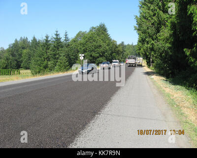 In 2018 WSDOT contractor crews from Granite Construction put a new surface on SR 20 between Sedro-Woolley and Concrete. The new surface is put down over the existing road (once road repair and crack sealing is done) to help protect the road from weather and traffic wear-and-tear. This work is much less expensive than paving and extends the life of the current pavement however, unlike paving, it does not create a new pavement surface for drivers, just coats the surface that is already there. SR 20 resurfacing 36712833740 o Stock Photo