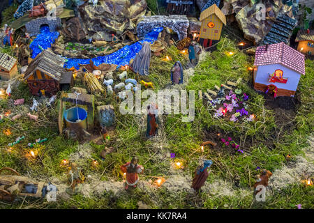 Christmas Manger scene with figurines including Jesus, Mary, Joseph, sheep and magi. Stock Photo