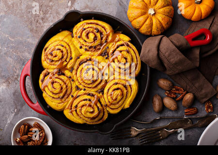 Pumpkin cinnamon rolls in a cast iron skillet Stock Photo