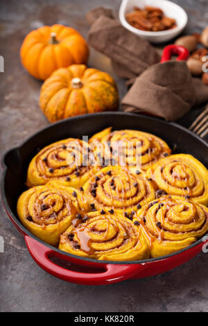 Pumpkin cinnamon rolls in a cast iron skillet Stock Photo