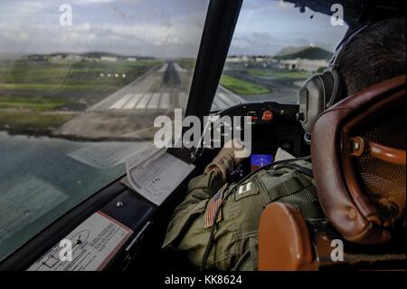 LT Christopher Malherek, assigned to the Golden Eagles of Patrol Squadron (VP) 9, prepares to land a P-3C Orion maritime patrol aircraft during a routine training flight for the squadron's advanced readiness program. Image courtesy Mass Communication Specialist 3rd Class Amber Porter/US Navy, Hawaii, USA, 2015. Stock Photo