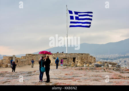 Greek flag flying in wind, Acropolis, Athens, Greece Stock Photo