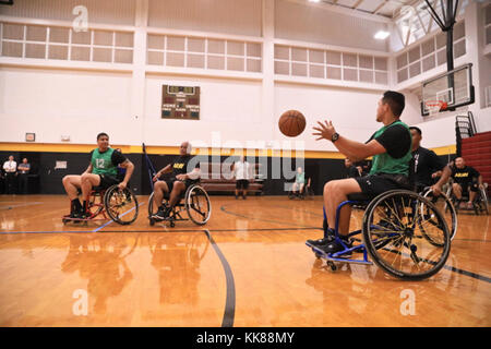 U.S. Army active duty and veteran athletes compete in wheelchair basketball for the 2017 Pacific Regional Warrior Game Trials Army Trials on Schofield Barracks, Hawaii, November 8, 2017. Approximately 80 wounded, ill or injured soldiers and veterans are in Hawaii to train and compete in a series of competitive athletic events including archery, cycling, shooting, sitting volleyball, swimming, track and field and wheelchair basketball. These competitions take place during November, which also coincides with Warrior Care Month. During Warrior Care Month we focus on activities that allow us to co Stock Photo