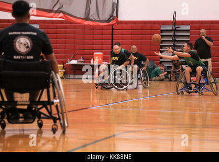 U.S. Army active duty and veteran athletes compete in wheelchair basketball for the 2017 Pacific Regional Warrior Game Trials Army Trials on Schofield Barracks, Hawaii, November 8, 2017. Approximately 80 wounded, ill or injured soldiers and veterans are in Hawaii to train and compete in a series of competitive athletic events including archery, cycling, shooting, sitting volleyball, swimming, track and field and wheelchair basketball. These competitions take place during November, which also coincides with Warrior Care Month. During Warrior Care Month we focus on activities that allow us to co Stock Photo